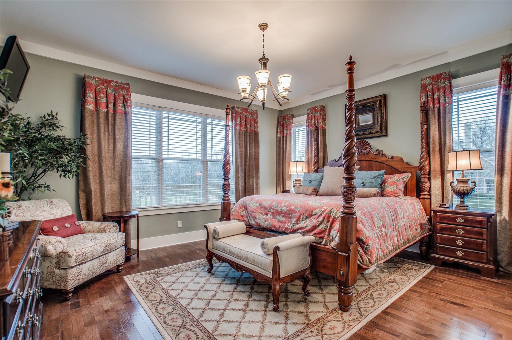 2533 Belle Brook Drive Franklin, TN 37067 - Photo 19 of 30 a spacious bedroom with a bed and a chandelier