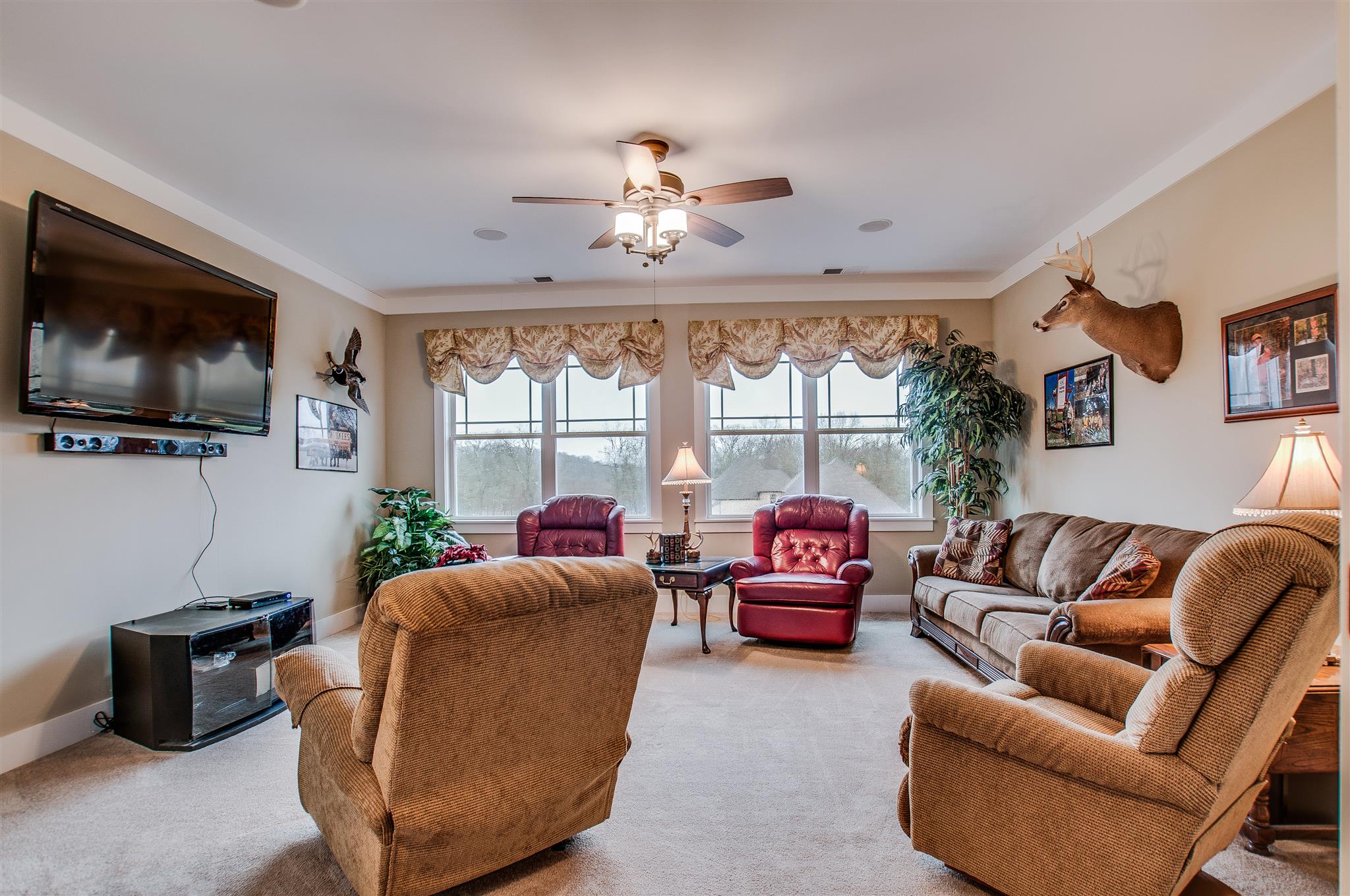 2533 Belle Brook Drive Franklin, TN 37067 - Photo 23 of 30 a living room with furniture a flat screen tv and a large window
