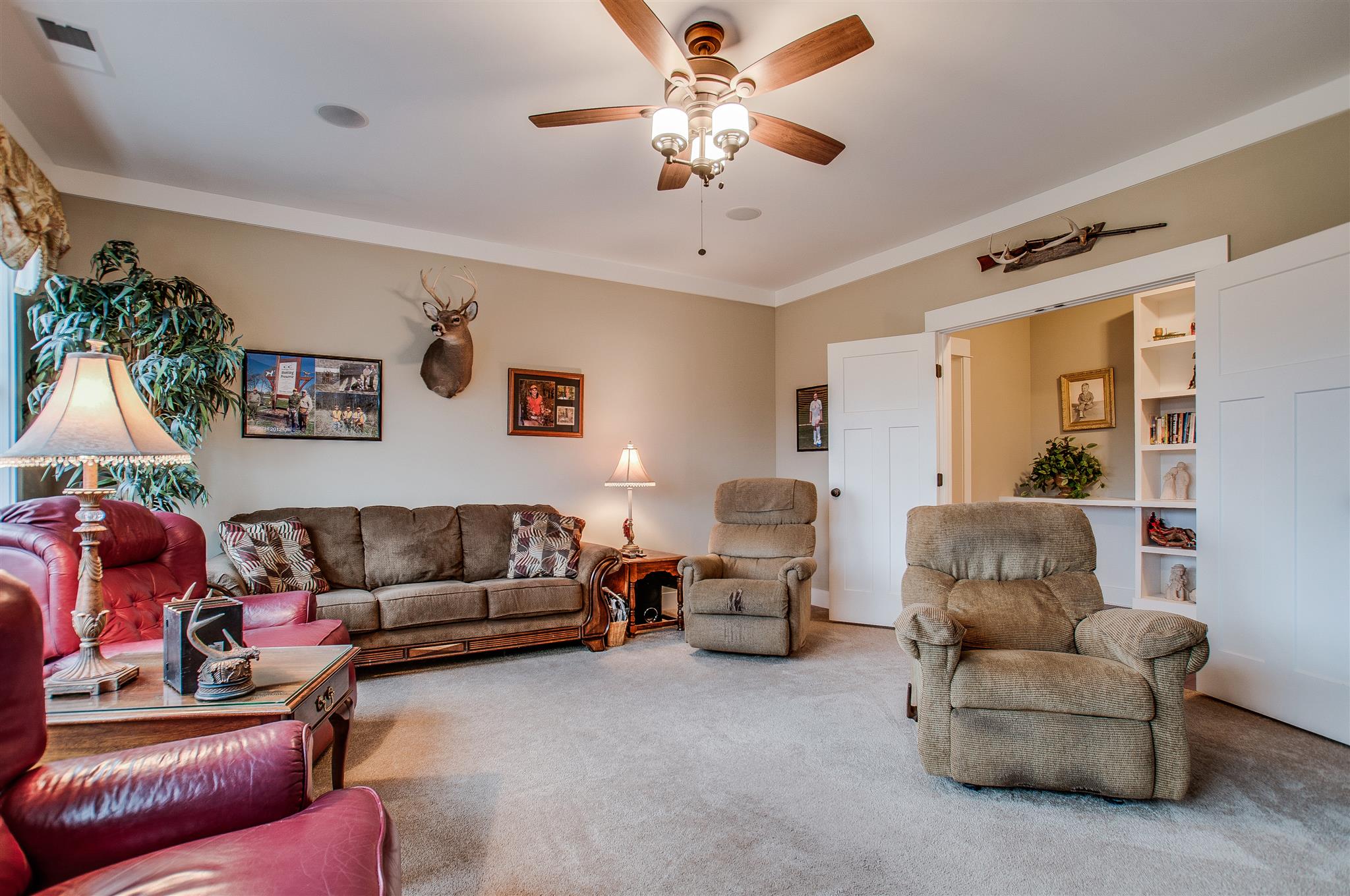 2533 Belle Brook Drive Franklin, TN 37067 - Photo 24 of 30 a living room with furniture and a chandelier