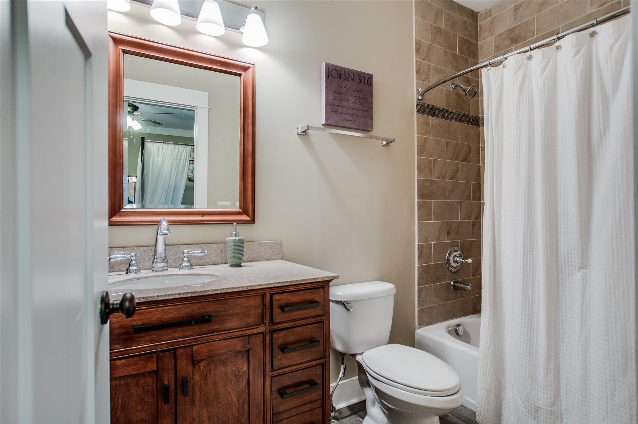 2533 Belle Brook Drive Franklin, TN 37067 - Photo 25 of 30 a bathroom with a sink a toilet a mirror and shower