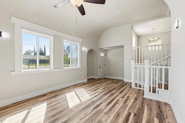a view of entryway and hall with wooden floor