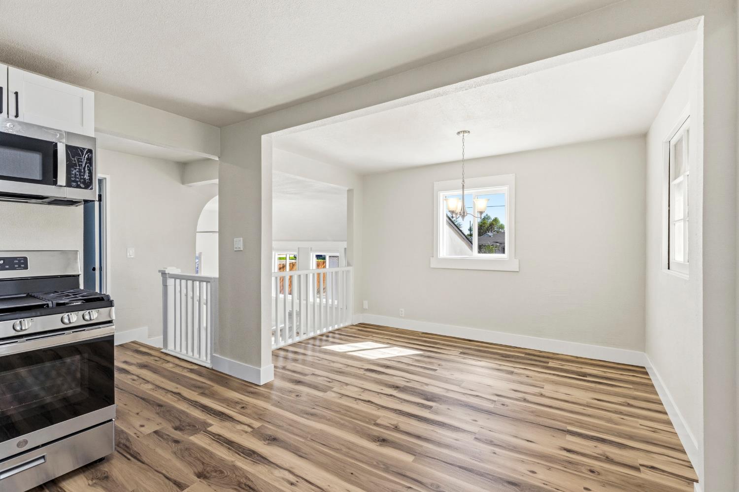 1821 River Road Modesto, CA 95351 - Photo 26 of 50 a view of a kitchen with wooden floor electronic appliances and windows