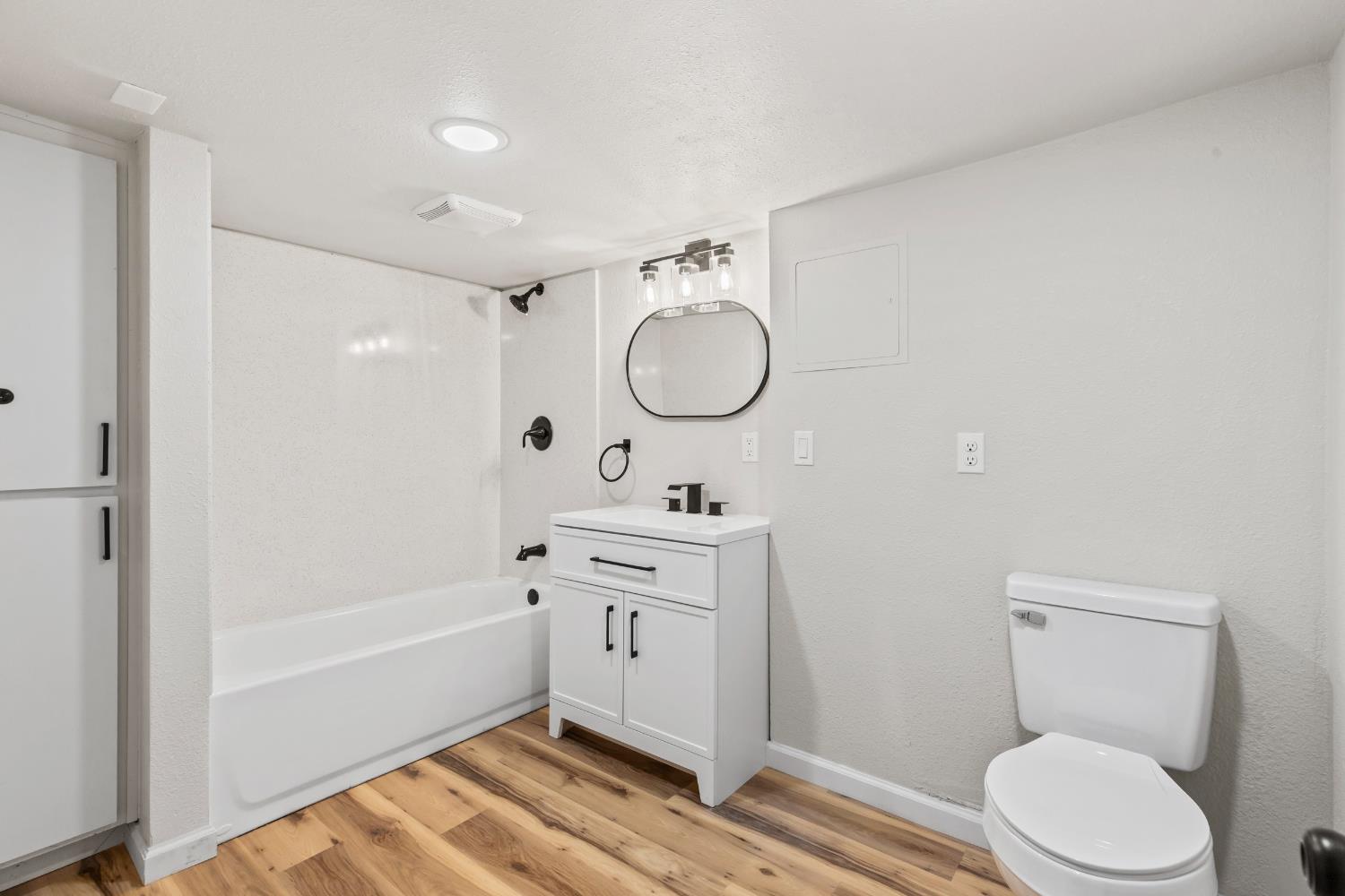 1821 River Road Modesto, CA 95351 - Photo 40 of 50 a bathroom with a sink a toilet and shower