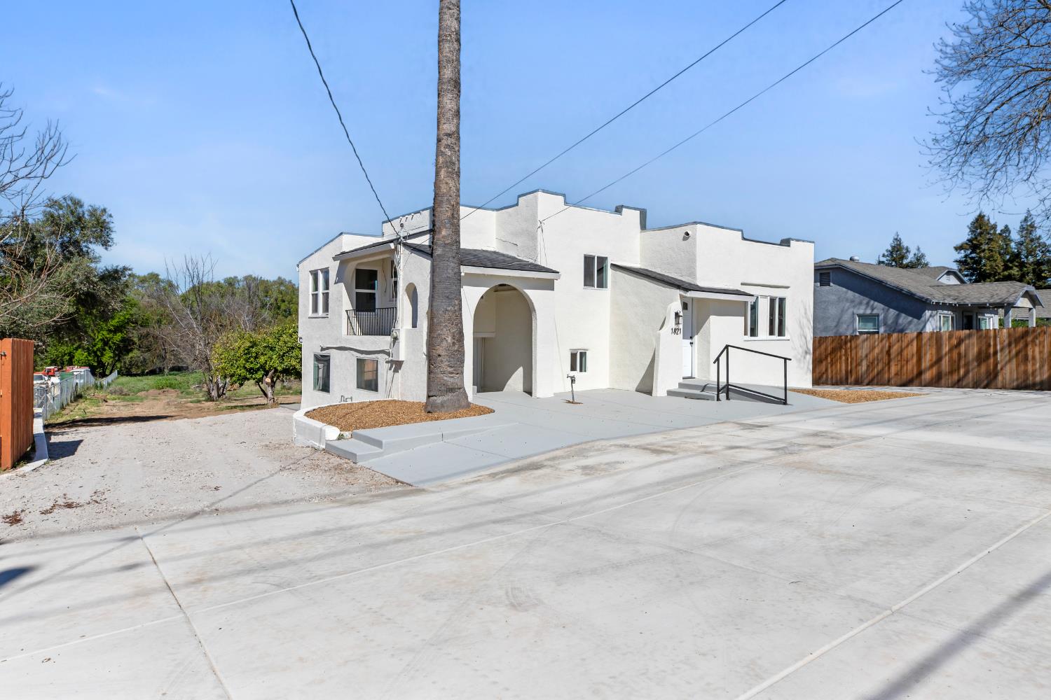 1821 River Road Modesto, CA 95351 - Photo 8 of 50 a view of a white house with a road