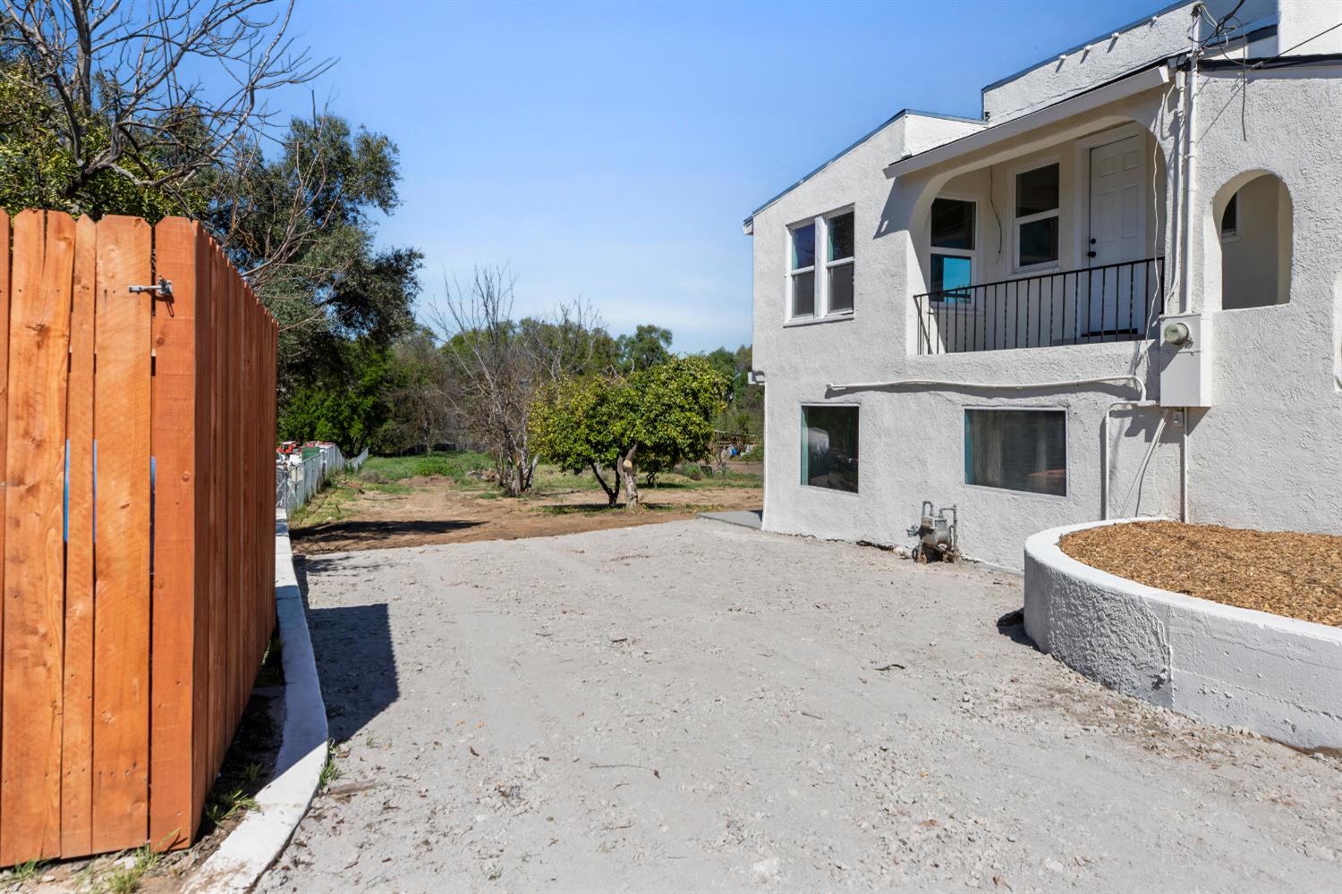 1821 River Road Modesto, CA 95351 - Photo 10 of 50 a front view of a house with a yard