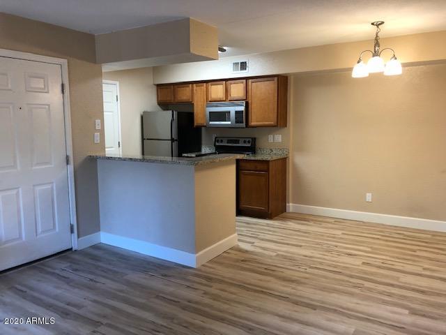 2625 East Indian School Road, Unit 204 Phoenix, AZ 85016 - Photo 18 of 20 Living Room with Kitchen View
