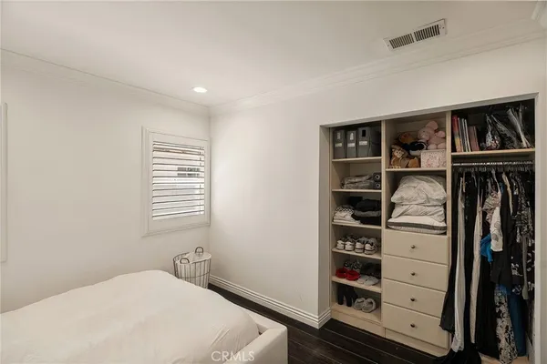 a bedroom with a bed and closet