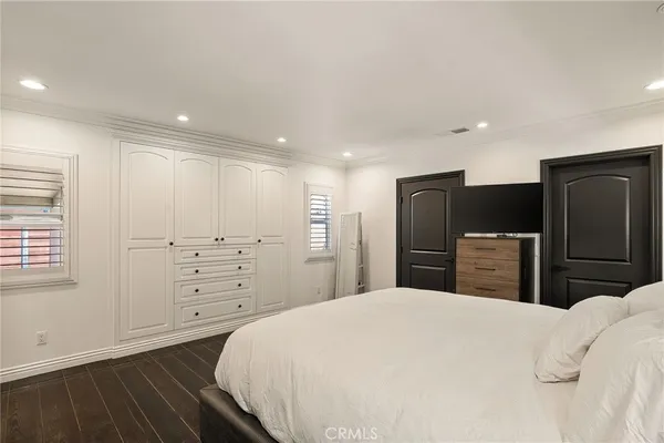 a bedroom with a bed and a closet