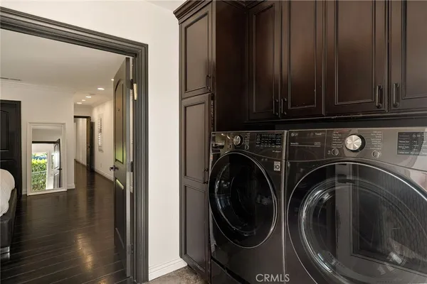 a view of a hallway with washer and dryer