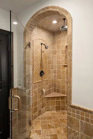 a bathroom with a glass door shower