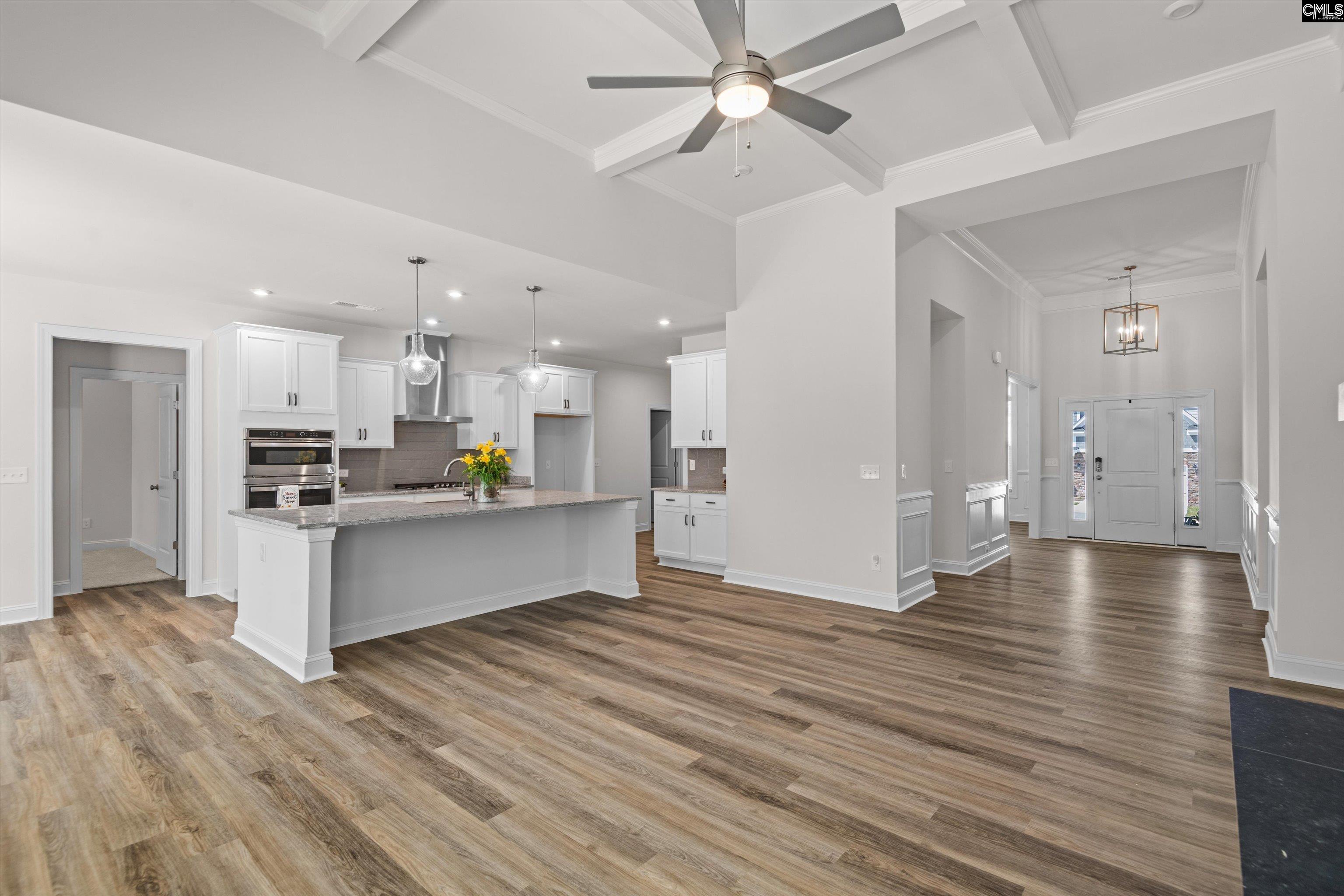 558 Wild Ginger Loop Irmo, SC 29063 - Photo 11 of 42 a view of kitchen with kitchen island white cabinets and stainless steel appliances