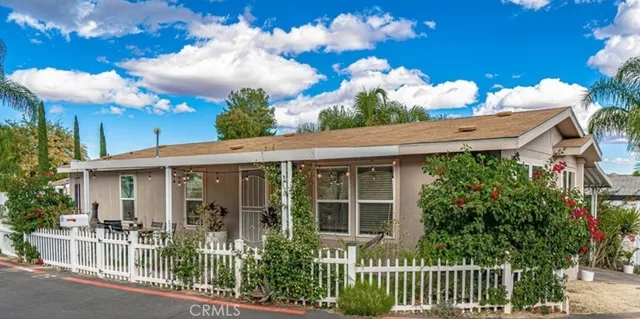 a view of a house with a yard and plants