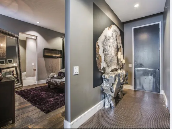 a bathroom with a granite countertop sink and a bathtub