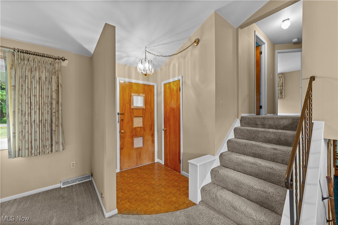 648 Rehwinkle Road Northfield, OH 44067 - Photo 3 of 38 Foyer entrance featuring a chandelier and stairs