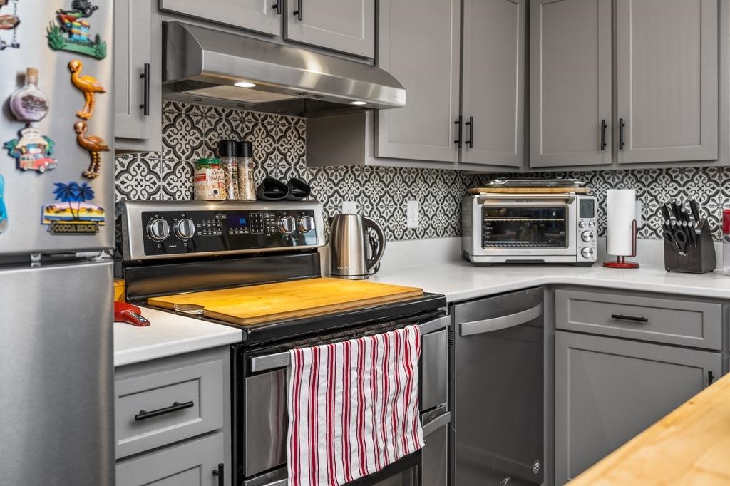 1008 Ladd Road Waynesboro, VA 22980 - Photo 19 of 46 a kitchen with stainless steel appliances granite countertop a stove a sink and a microwave