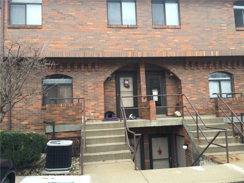 a front view of a house with outdoor seating