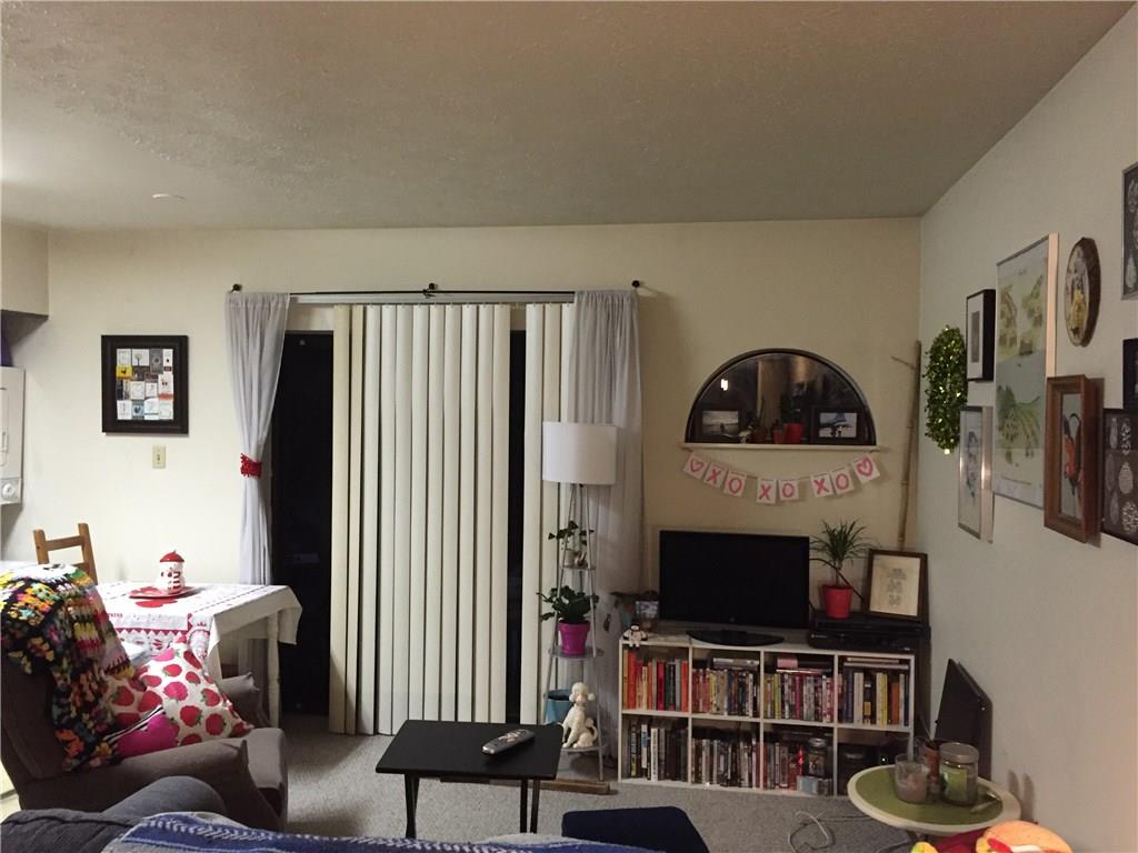 3271 Niagara Square Pittsburgh, PA 15213 - Photo 2 of 5 a living room with furniture and a flat screen tv