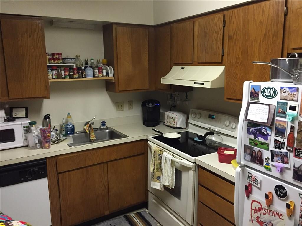 3271 Niagara Square Pittsburgh, PA 15213 - Photo 3 of 5 a kitchen with stainless steel appliances a stove refrigerator sink and cabinets