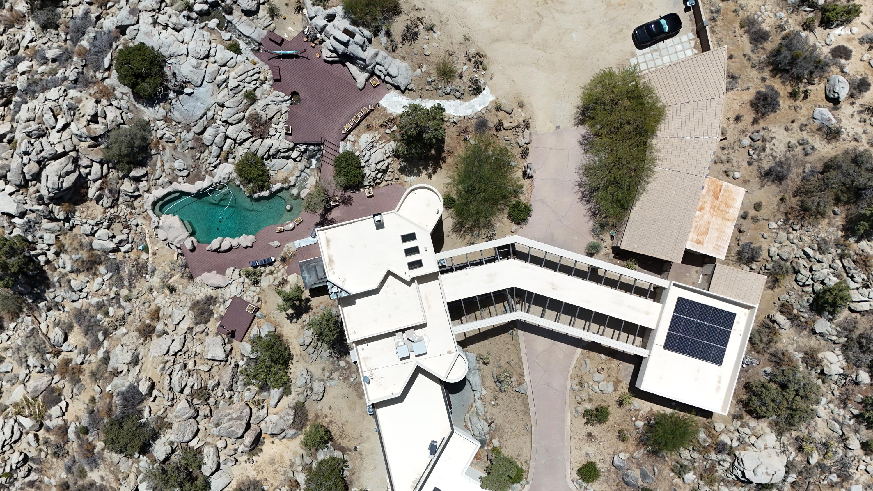 61400 Yucca Road Mountain Center, CA 92561 - Photo 2 of 2 an aerial view of a house with a yard and trees