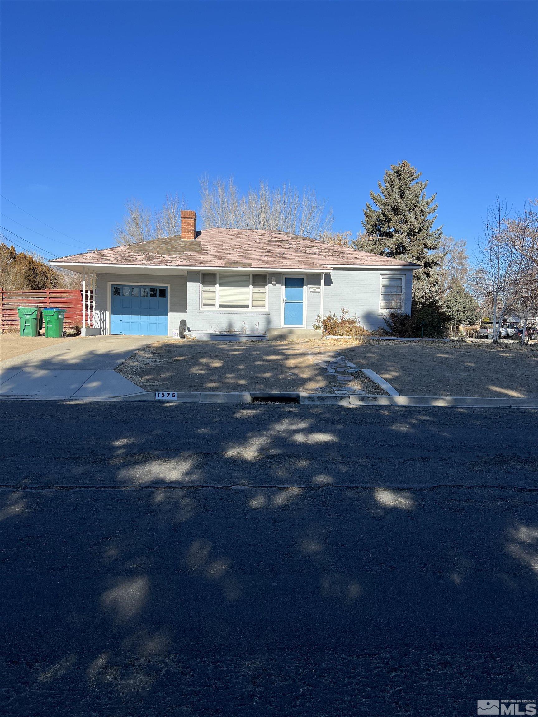 1575 Allen Street Reno, NV 89509 - Photo 1 of 8 a front view of a house with a yard