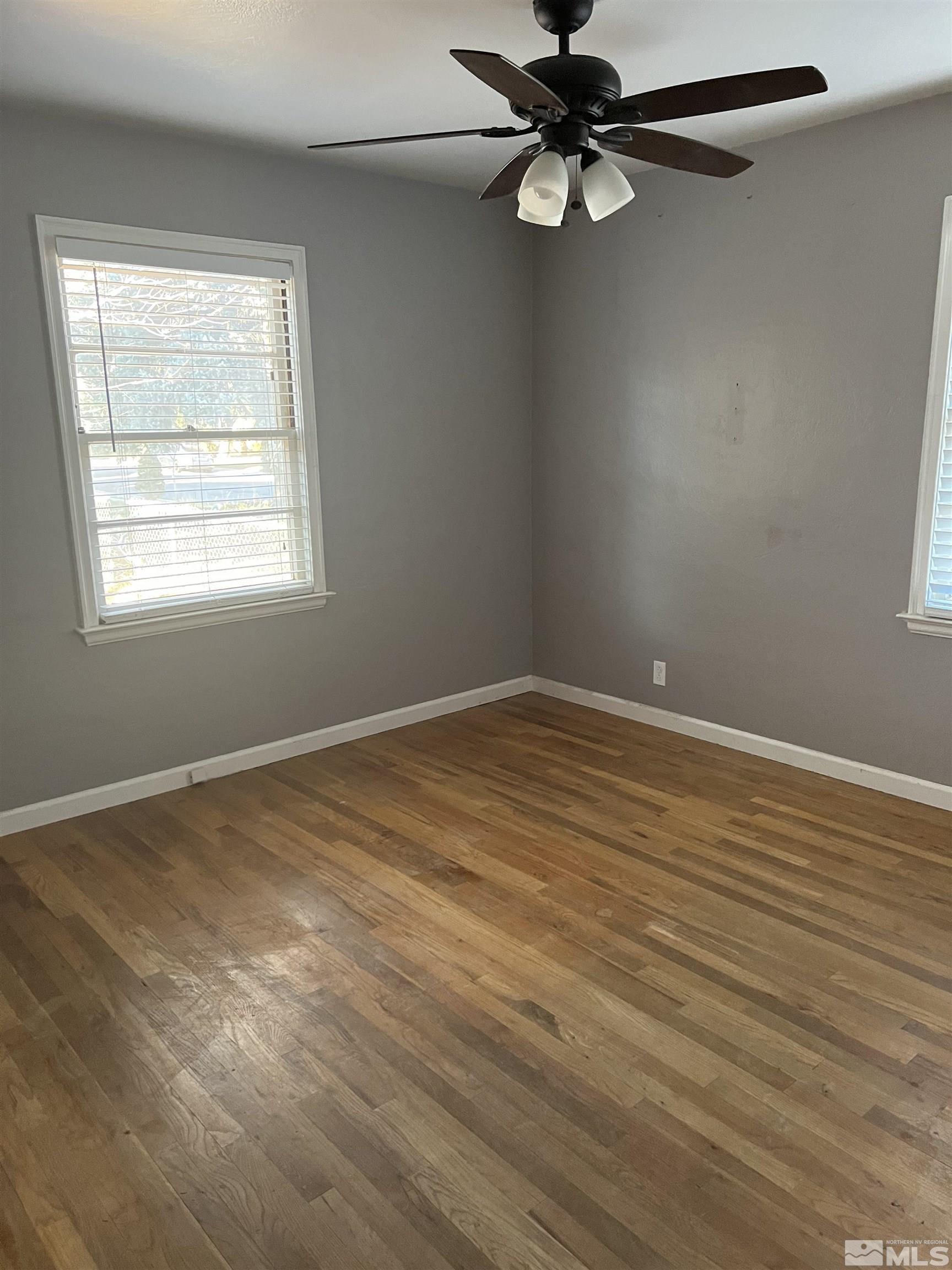 1575 Allen Street Reno, NV 89509 - Photo 5 of 8 an empty room with a window and a fan