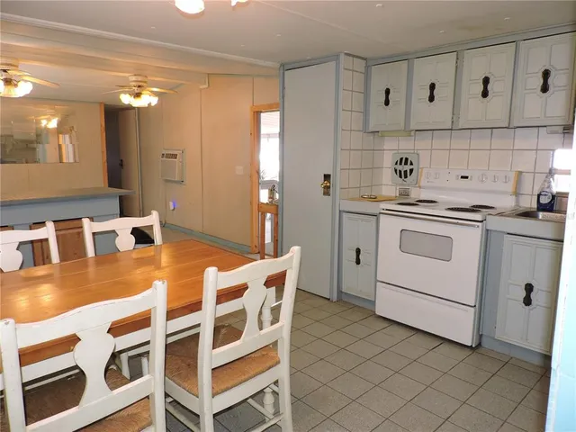 a view of a dining room with furniture and window