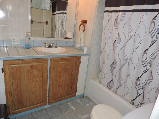 a utility room with a sink and washer