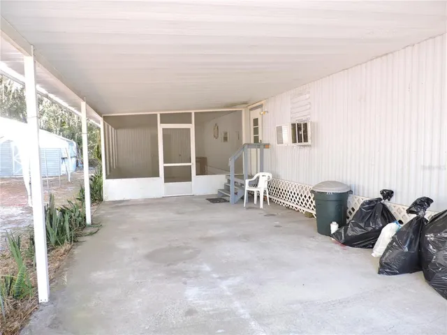 a kitchen with cabinets and window