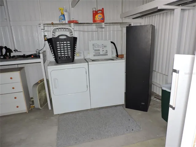 a view of a house with a yard and garage