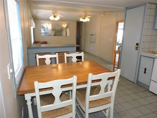 a kitchen with a stove a sink and a refrigerator