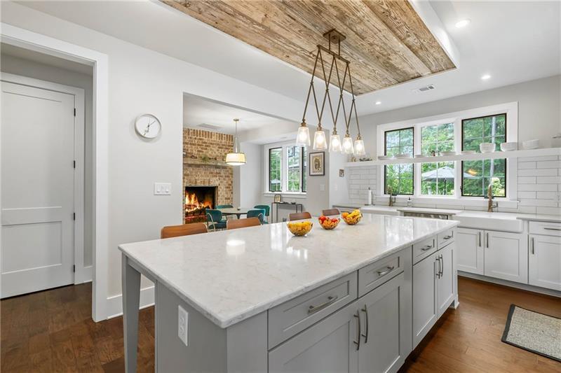 7255 Old Rico Road Chattahoochee Hills, GA 30268 - Photo 26 of 78 a view of a kitchen counter space a sink a window and stainless steel appliances