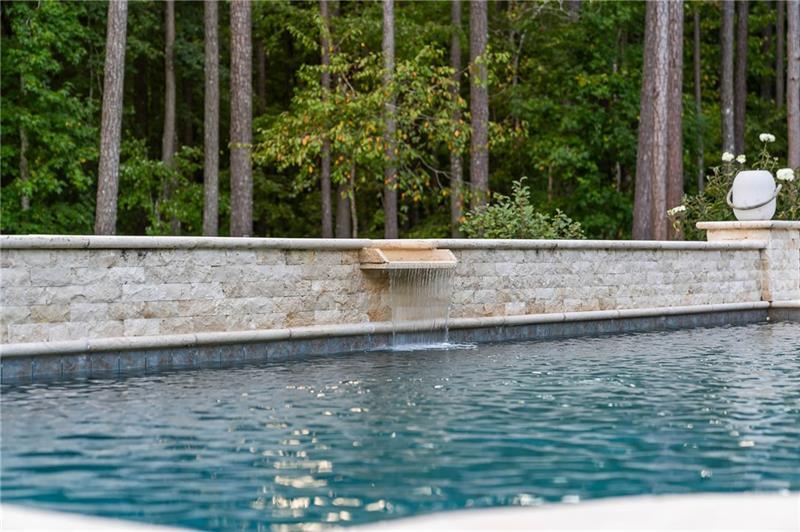 7255 Old Rico Road Chattahoochee Hills, GA 30268 - Photo 57 of 78 a view of swimming pool with lawn chairs and large trees