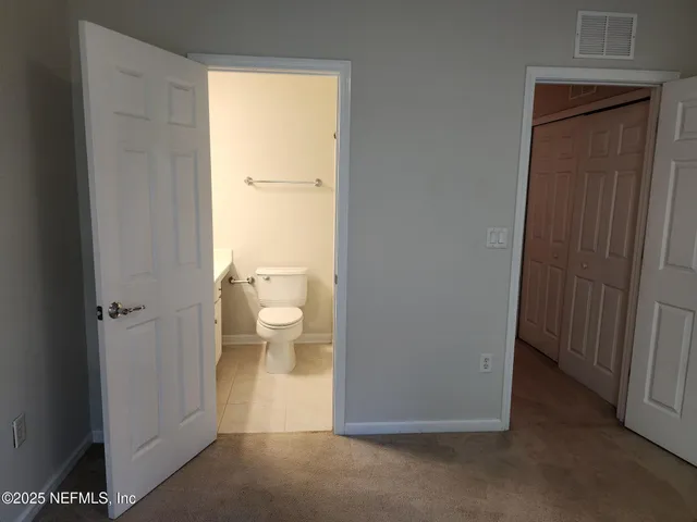 a view of bathroom with a toilet