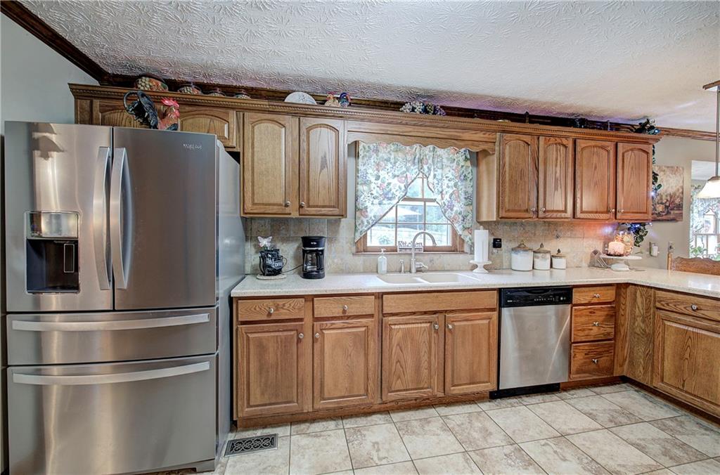 3637 Nebo Road Hiram, GA 30141 - Photo 19 of 63 a kitchen with stainless steel appliances granite countertop a refrigerator sink and cabinets