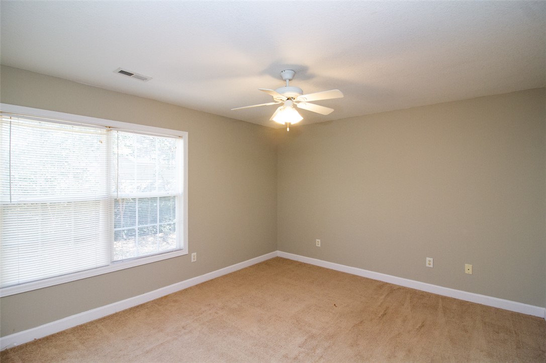735 Britton Street Anderson, SC 29621 - Photo 32 of 50 This spacious room offers comfort with carpet flooring and ample natural light.