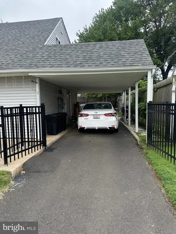 a view of car parked in front of house