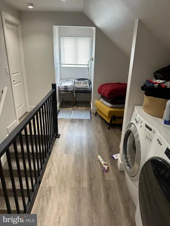 a bedroom with bed and a window