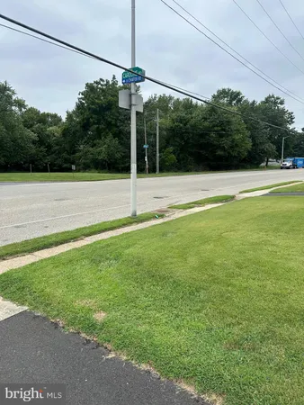 a view of a yard with a swimming pool