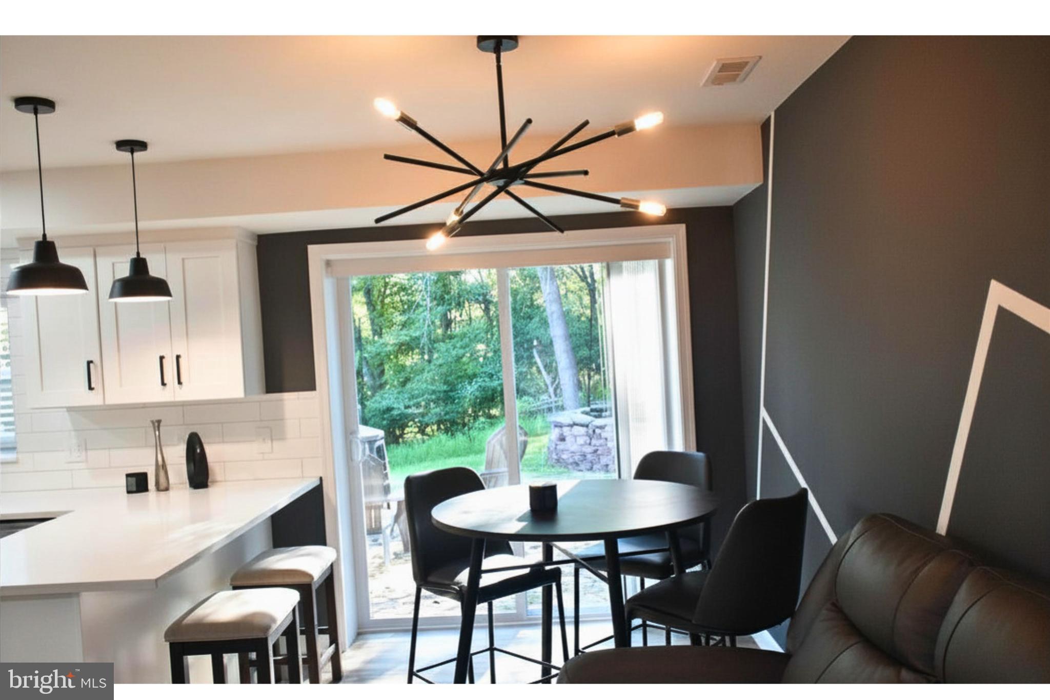 17930 Masemore Road Parkton, MD 21120 - Photo 16 of 46 a view of a dining room with furniture window and outside view