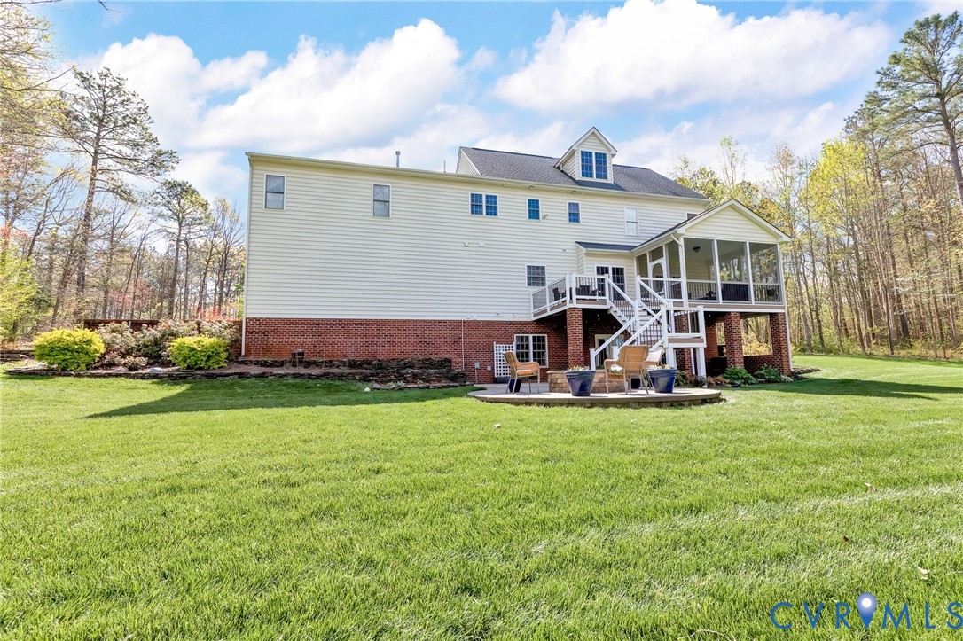 14436 Overlook Ridge Lane Beaverdam, VA 23015 - Photo 70 of 82 a view of a house with a big yard and large trees
