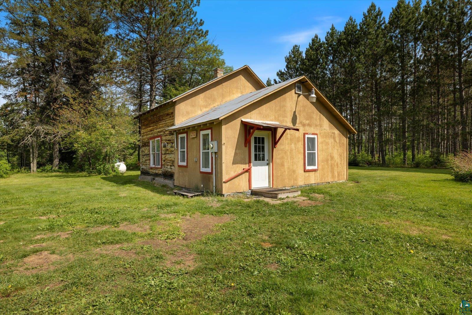 480 Rikala Brimson, MN 55602 - Photo 2 of 38 View of side of property featuring a yard and a metal roof