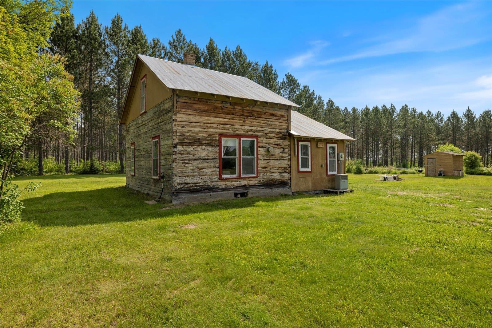 480 Rikala Brimson, MN 55602 - Photo 3 of 38 View of cabin featuring a forest view