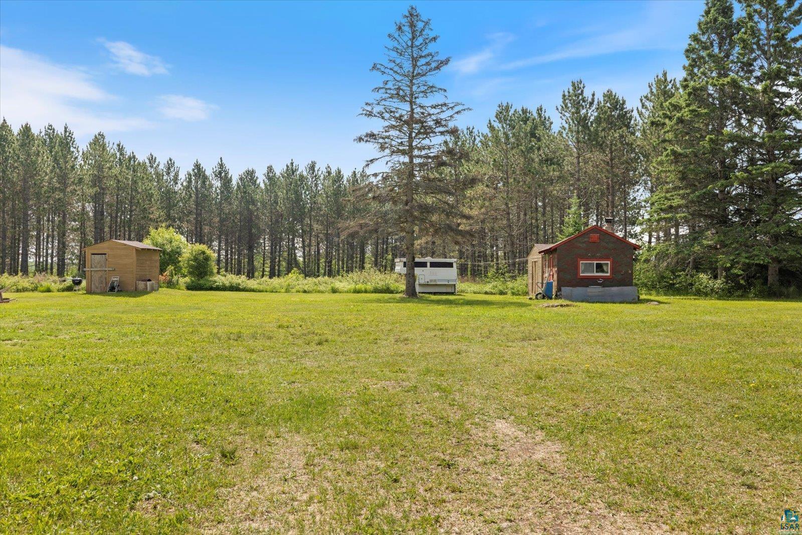 480 Rikala Brimson, MN 55602 - Photo 38 of 38 View of green lawn featuring a storage shed and Sauna