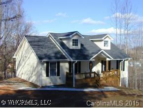 77 Hampton Road Leicester, NC 28748 - Photo 2 of 9 a front view of a house with garden