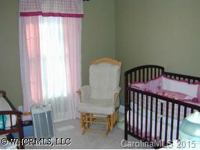 77 Hampton Road Leicester, NC 28748 - Photo 7 of 9 a view of a bedroom with furniture and window