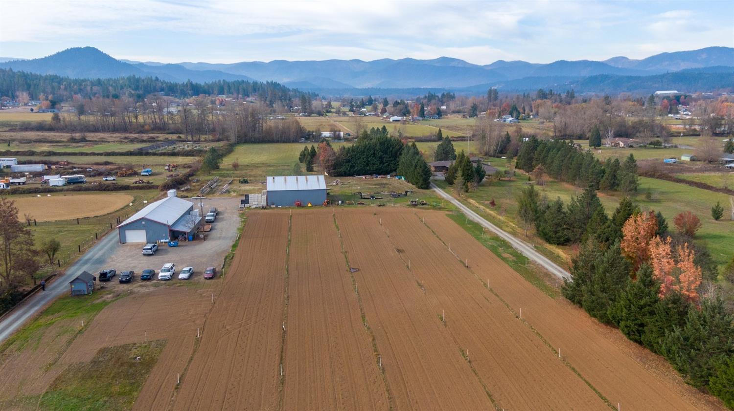 1496 Boundary Road Grants Pass, OR 97527 - Photo 1 of 26 an aerial view of a house with a garden