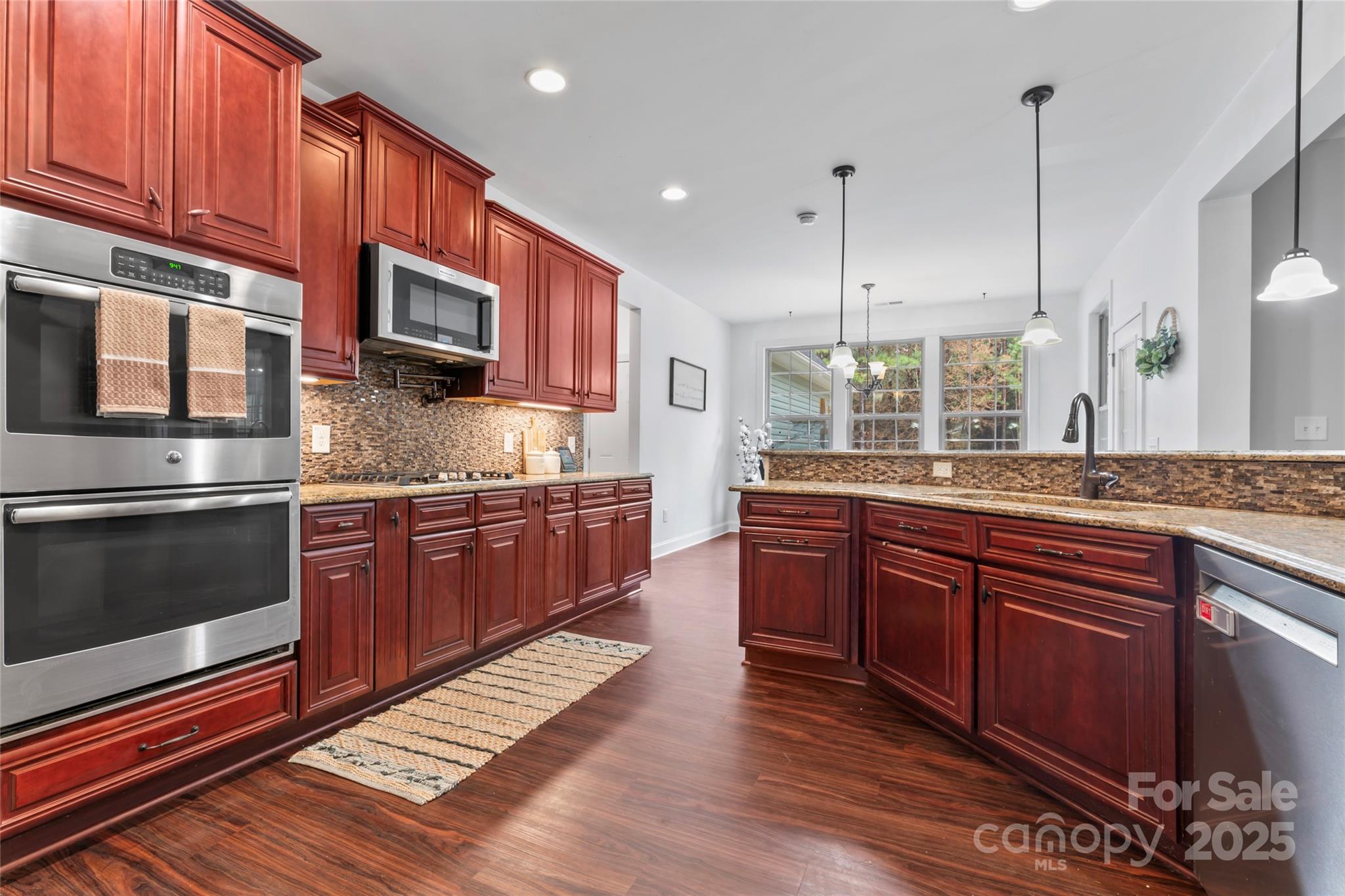 1485 State Rd S-46-1102 York, SC 29745 - Photo 14 of 42 a large kitchen with stainless steel appliances granite countertop a stove a sink and a microwave
