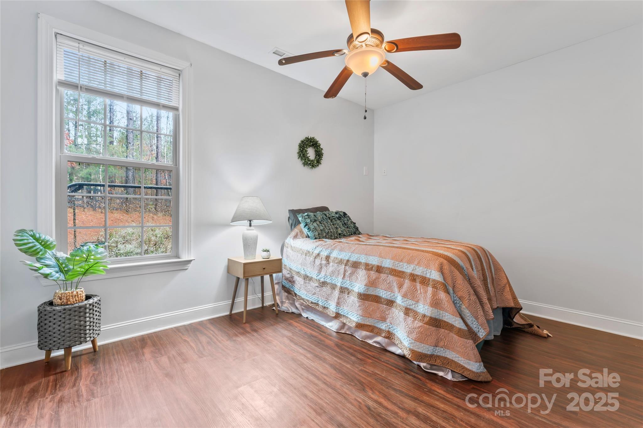 1485 State Rd S-46-1102 York, SC 29745 - Photo 24 of 42 a bedroom with a bed chandelier and a window