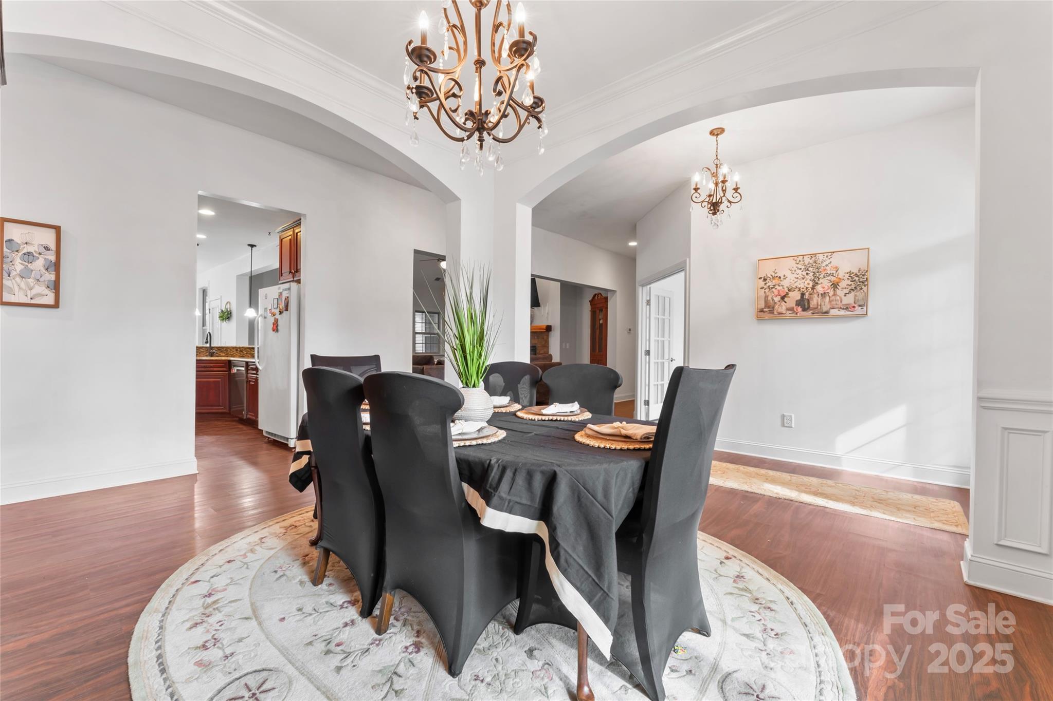 1485 State Rd S-46-1102 York, SC 29745 - Photo 5 of 42 a dining room with furniture wooden floor a rug and a chandelier