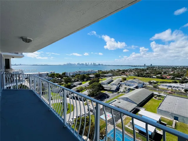 a view of a balcony with city view